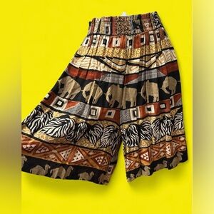 Vintage 90’s high rise safari animal print flowy shorts. Small-medium